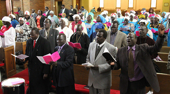 South Sudanese sing at the first Presbyterian Church of Albert Lea (Albert Lea Tribune)