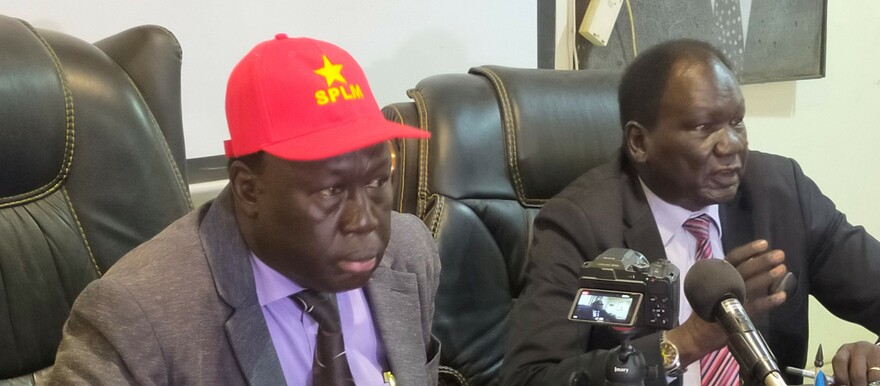 Kuol Atem Bol, SPLM’s secretary for political affairs, organization, and mobilization (L), speaking at a press conference in Juba on 26 October 2022. (Photo: Radio Tamazuj)