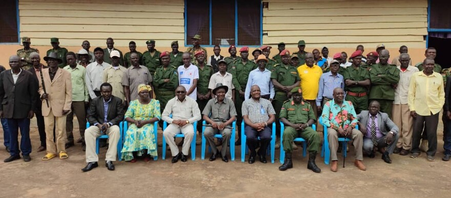 Soldiers, chiefs and civilians pose after a civil-military relations forum in Yei on 14 March 2023. [Photo: Radio Tamazuj]