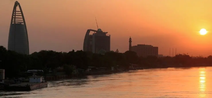 This picture taken on September 21, 2021 shows a view of the (L to R) landmark Greater Nile Petroleum Oil Company (GNPOC) Tower and PetroDar Operating Company (PDOC) Tower near the Blue Nile river waterfront in the north of Sudan's capital Khartoum at sunset. (AFP)