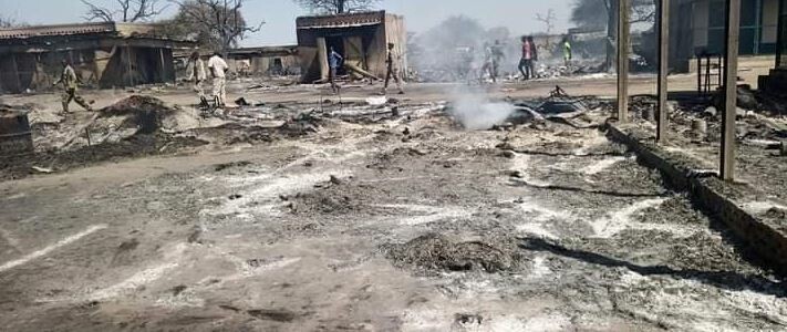 Burnt out houses in Aneet market after fighting erupted there in February 2022. (File photo)