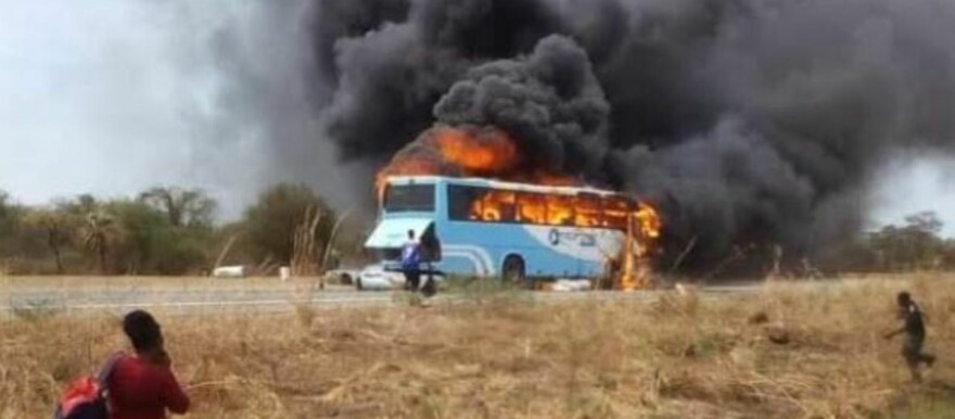 The bus belonging to the Trinity Bus Company caught fire on the Juba-Bor Highway on Tuesday afternoon. (Courtesy photo)