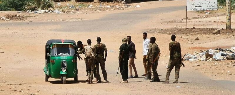Sudanese army soldiers man a checkpoint in Khartoum as violence between two rival Sudanese generals continues. AFP