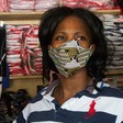 A trader puts on a face mask to prevent the spread of COVID-19 between her and customers at Konyo-konyo market in Juba. @UNICEFSouthSudan/Chol