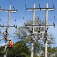 A JEDCO employee connecting electricity. (JEDCO picture)