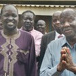 NDM's Lam Akol (in a grey Kaunda suit) speaks to the press as leaders of political parties look on. (Photo: Radio Tamazuj)