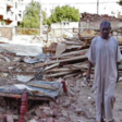 A man walks through the debris of homes destroyed by artillery shells in Khartoum. (File photo)